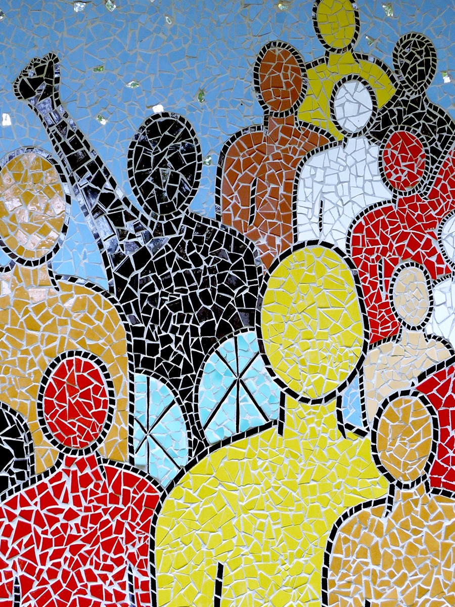 a mosaic of human figures of various colours